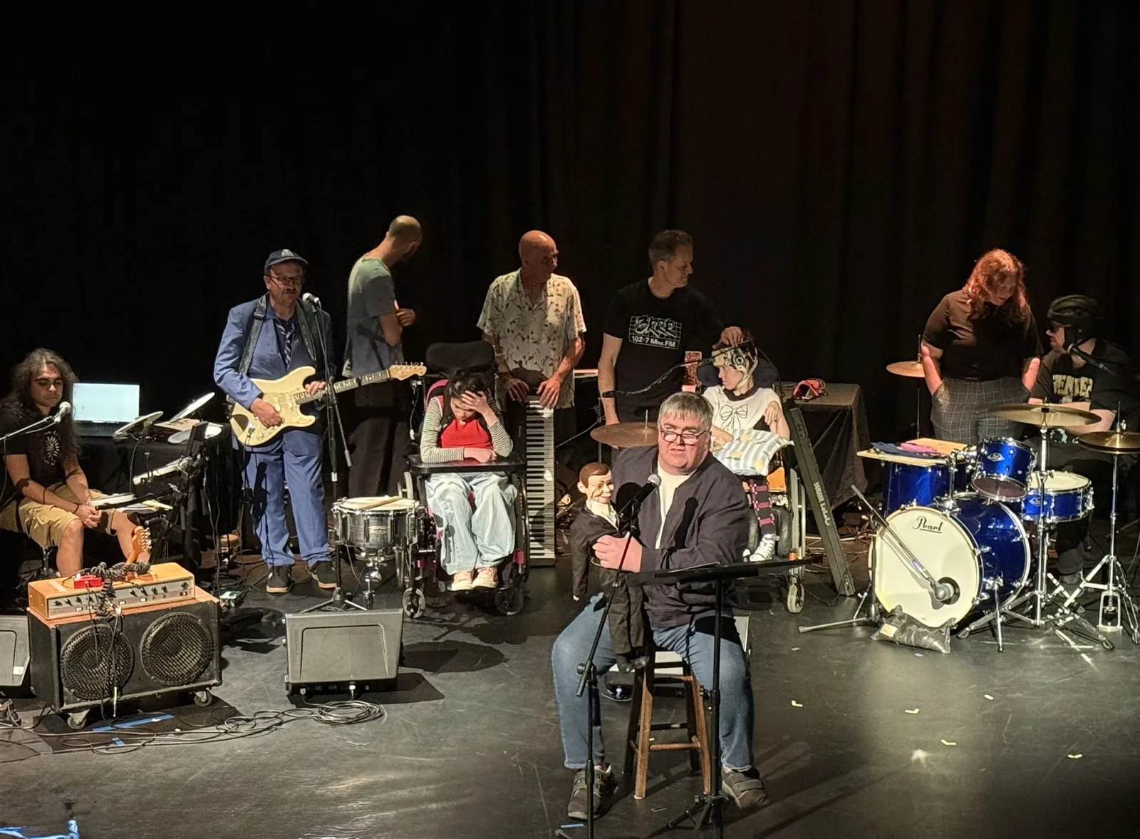 A large mixed-ability ensemble performing on stage at the Safe in Sound Festival